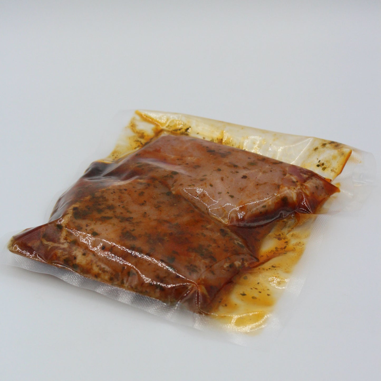 Schweinerückensteaks in Kräuter mariniert
